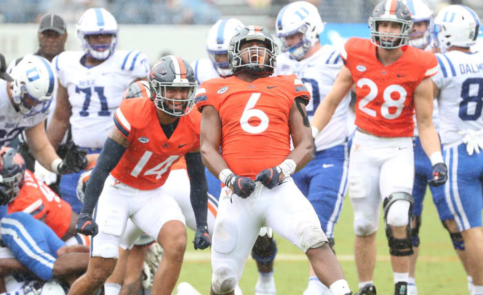 Virginia senior linebacker Nick Jackson celebrates after making a tackle against Duke.